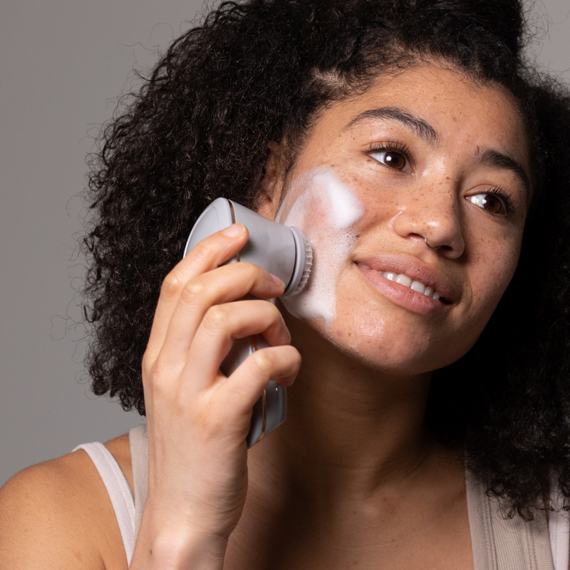 Model using MAGNITONE BareFaced3 Cleansing Brush