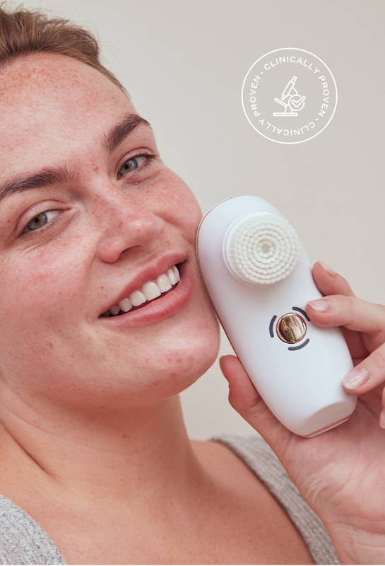 Model holding BareFaced2 Sensitive Cleansing Brush