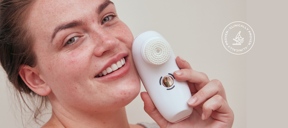 Model holding BareFaced2 Sensitive Cleansing Brush