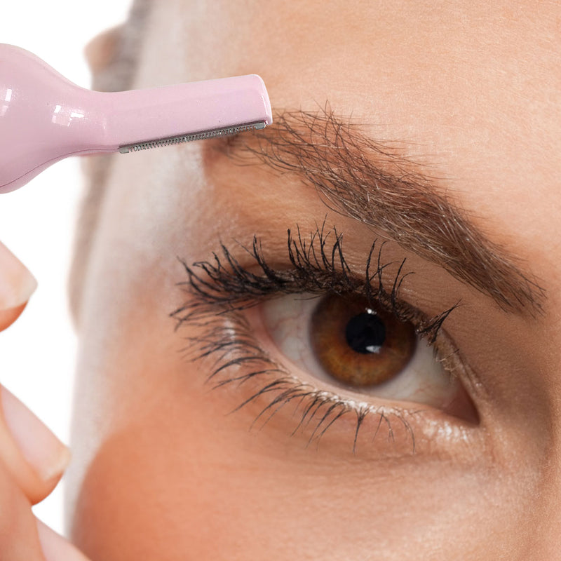 Close up of Pink FUZZOFF trimming eyebrow hairs